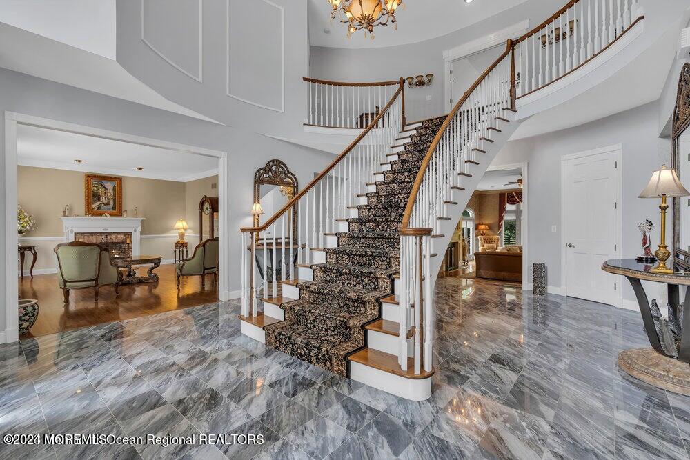 65 Cross Road Colts Neck, NJ 07722 - Photo 5 of 21 a view of entryway and hall with wooden floor