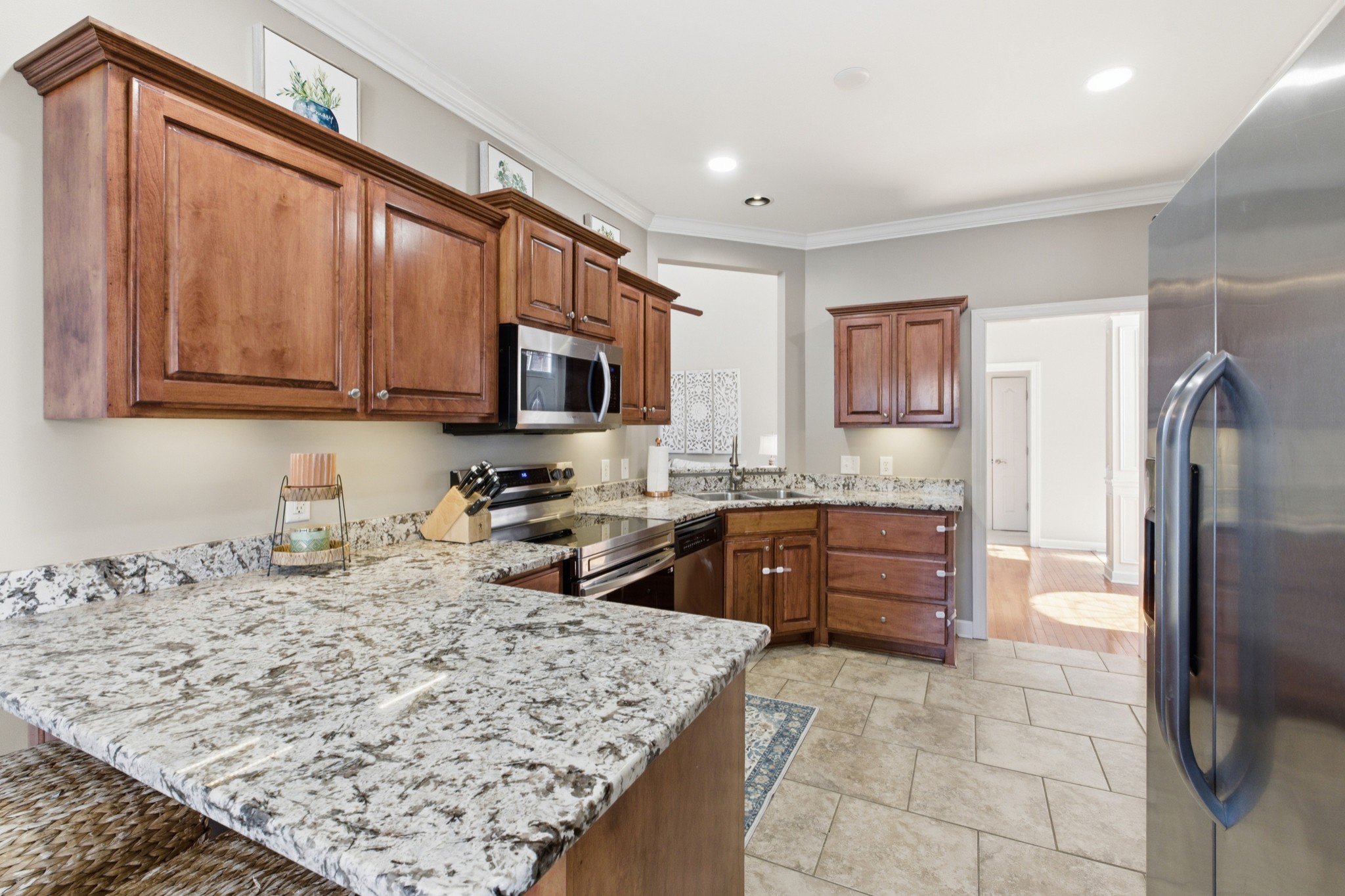 608 Windtree Pass Mount Juliet, TN 37122 - Photo 12 of 35 a kitchen with stainless steel appliances granite countertop a refrigerator stove top oven and sink