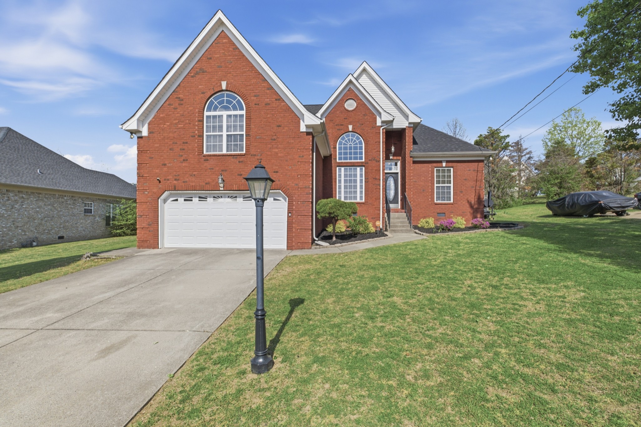 608 Windtree Pass Mount Juliet, TN 37122 - Photo 2 of 35 a front view of a house with garden