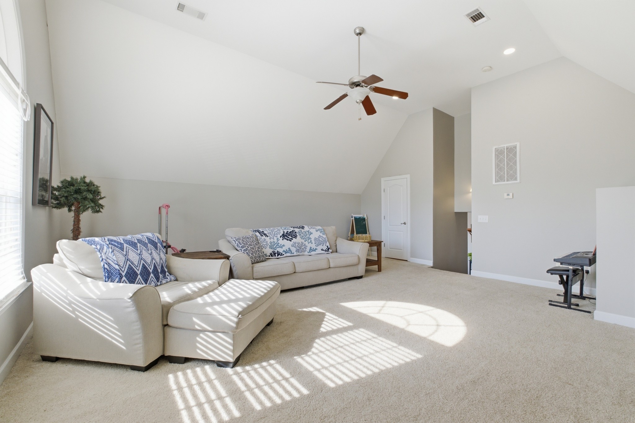 608 Windtree Pass Mount Juliet, TN 37122 - Photo 26 of 35 a living room with furniture and a chandelier