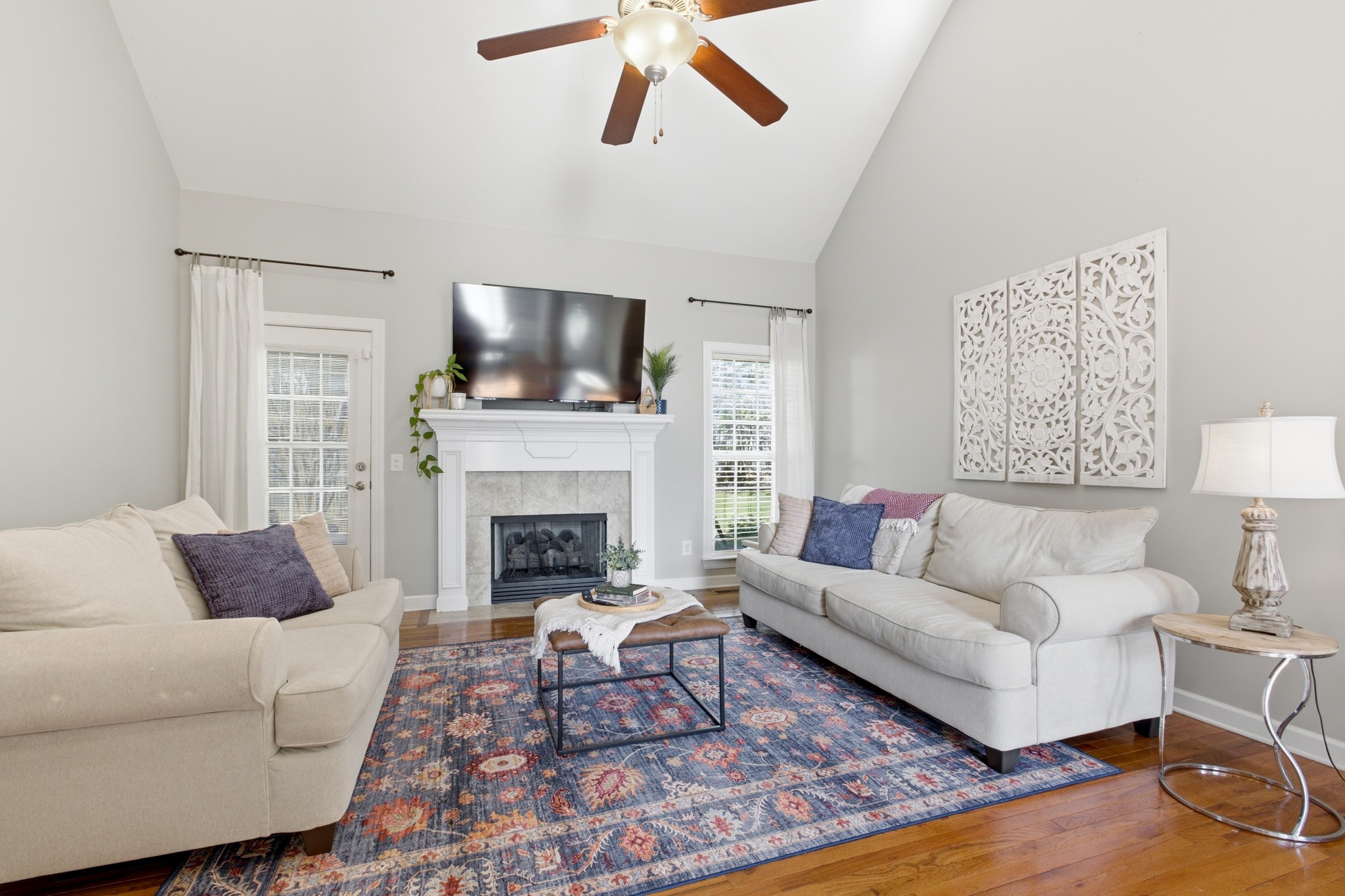 608 Windtree Pass Mount Juliet, TN 37122 - Photo 4 of 35 a living room with furniture a flat screen tv and a fireplace