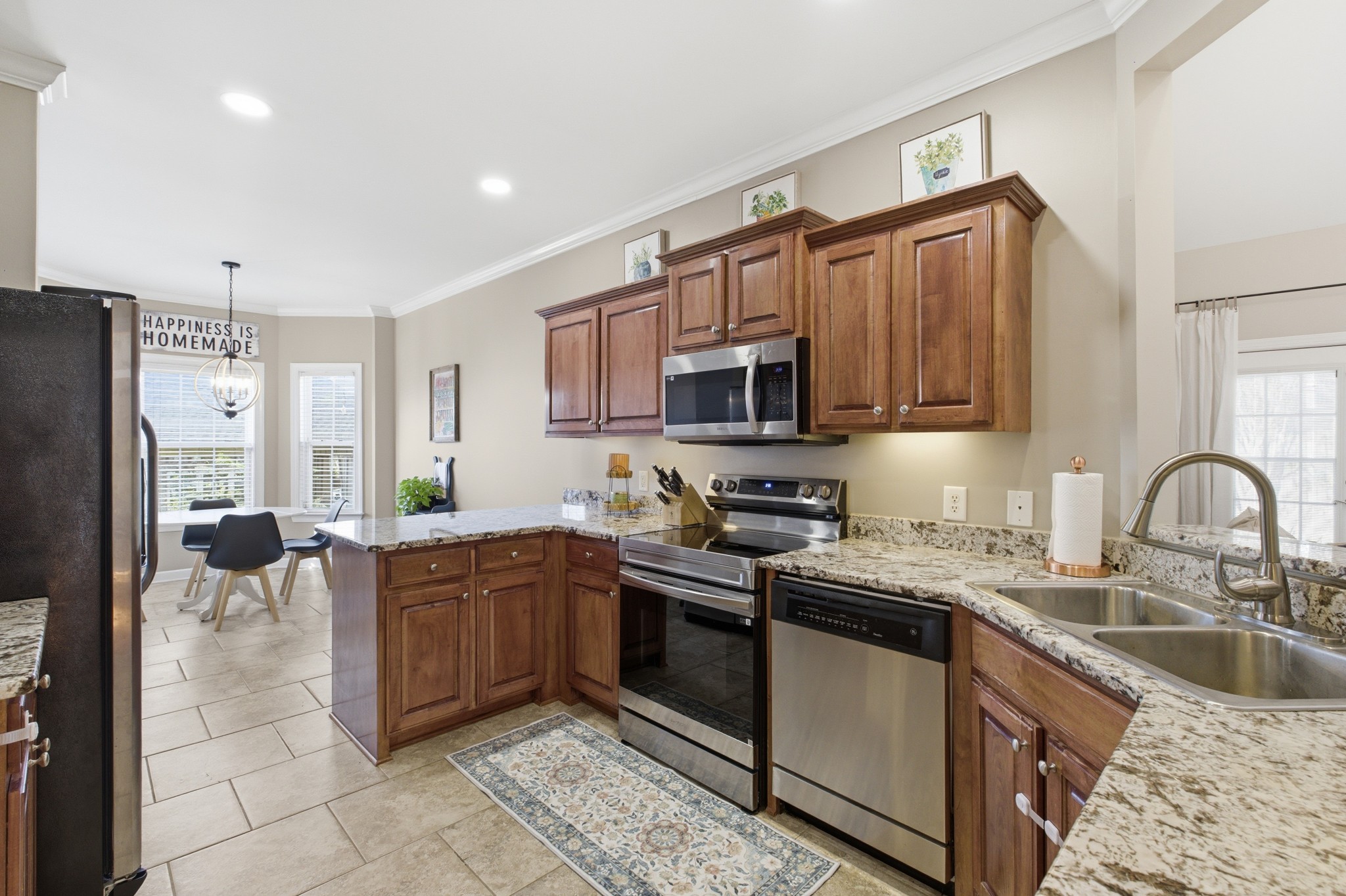 608 Windtree Pass Mount Juliet, TN 37122 - Photo 10 of 35 a kitchen with stainless steel appliances granite countertop a sink a stove a refrigerator cabinets a sink and a stove