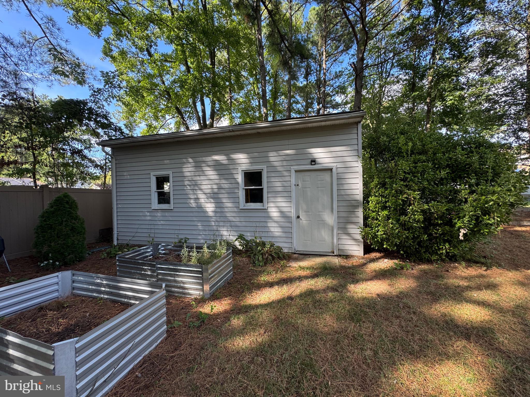 211 Queen Anne Road Stevensville, MD 21666 - Photo 48 of 56 Back yard and big storage garage