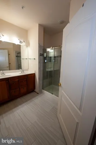a bathroom with a tub sink and shower