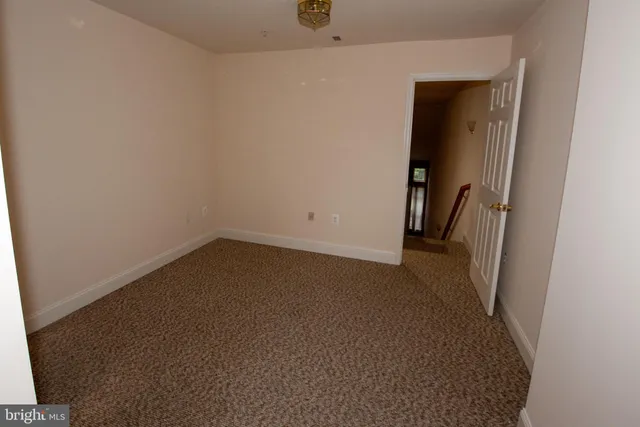 an empty room with a hallway