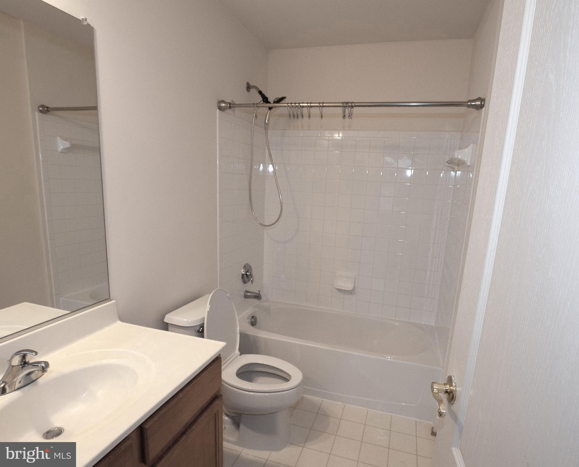13204 Rabbit Chase Road Laurel, MD 20707 - Photo 21 of 35 a bathroom with a sink a toilet and shower