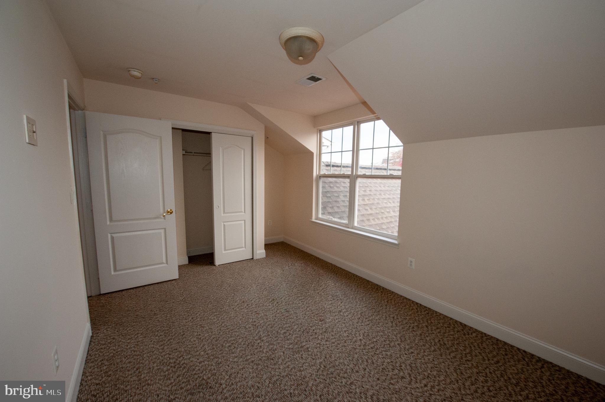 13204 Rabbit Chase Road Laurel, MD 20707 - Photo 25 of 35 an empty room with windows and closet