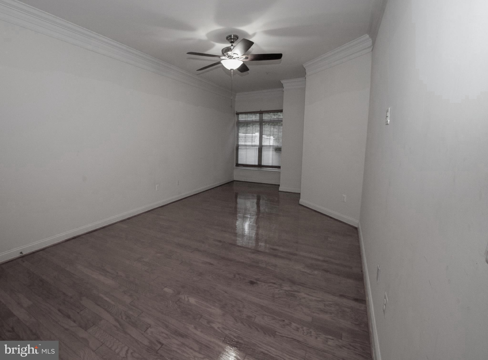 13204 Rabbit Chase Road Laurel, MD 20707 - Photo 9 of 35 wooden floor in an empty room with a window