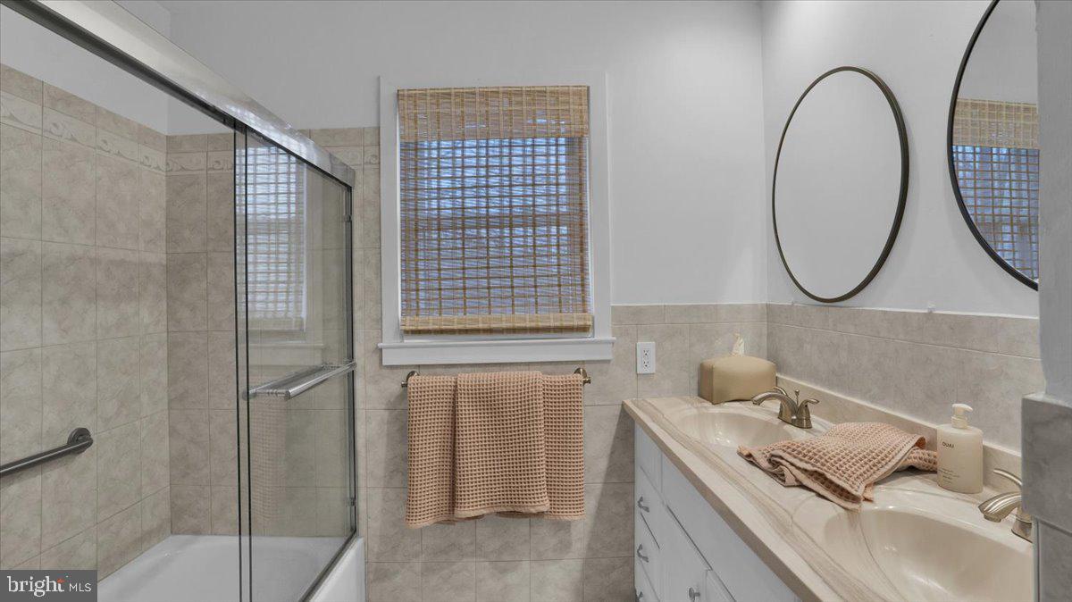 1433 Southwind Way Dresher, PA 19025 - Photo 19 of 37 a bathroom with a sink and a mirror