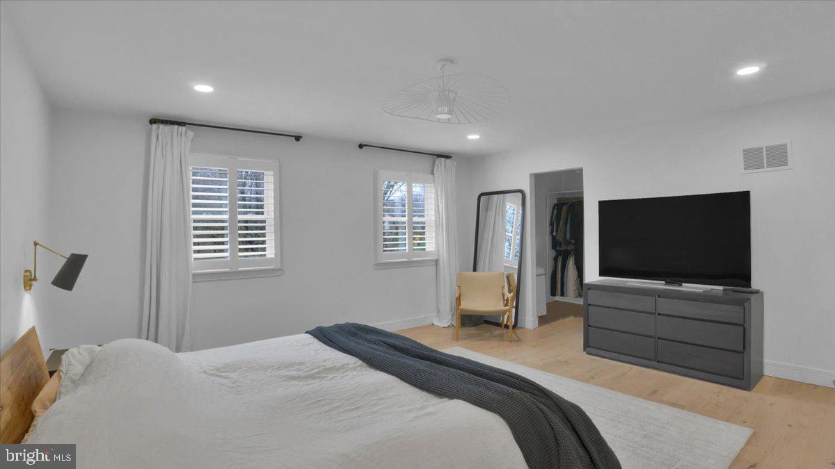 1433 Southwind Way Dresher, PA 19025 - Photo 21 of 37 a bedroom with a bed and a flat screen tv