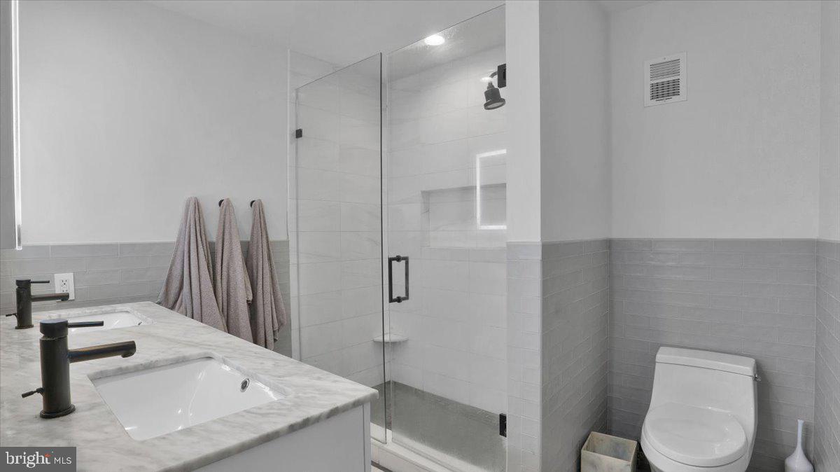 1433 Southwind Way Dresher, PA 19025 - Photo 22 of 37 a bathroom with a granite countertop sink toilet and shower