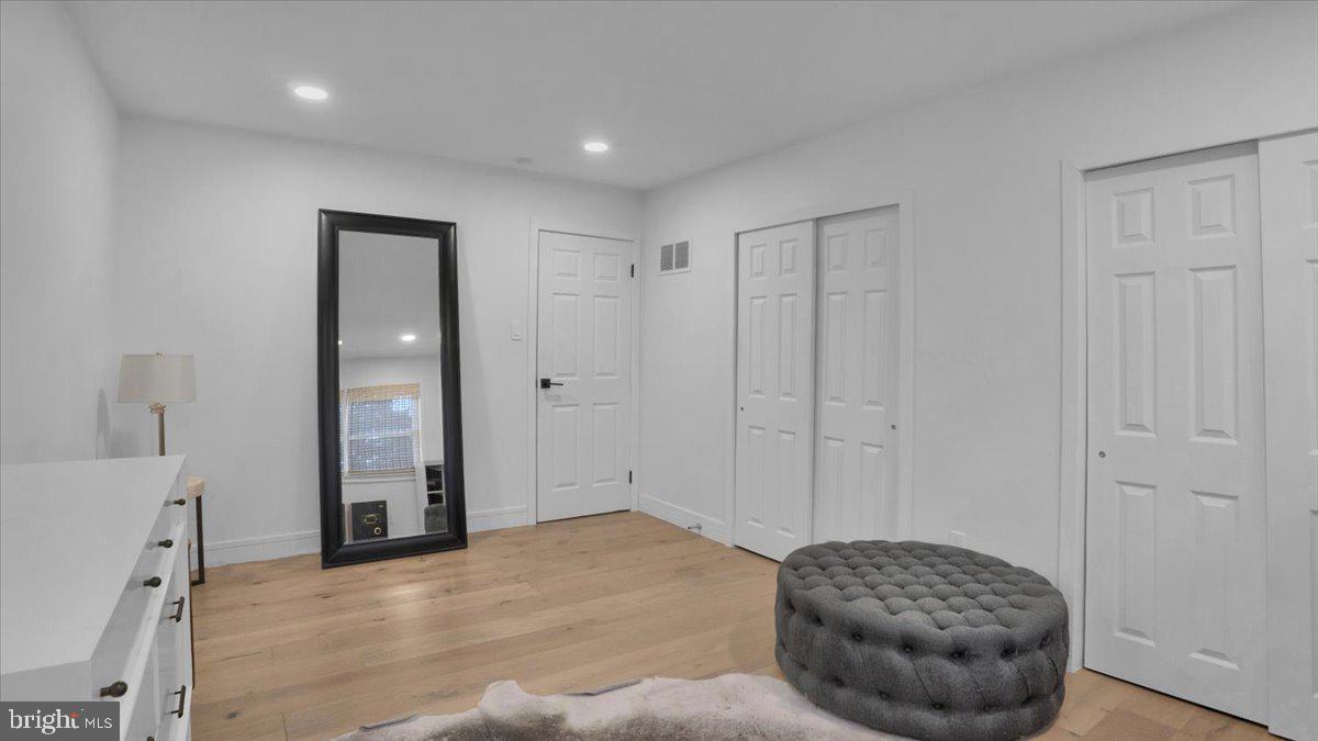 1433 Southwind Way Dresher, PA 19025 - Photo 24 of 37 a bedroom with a bed and a chandelier
