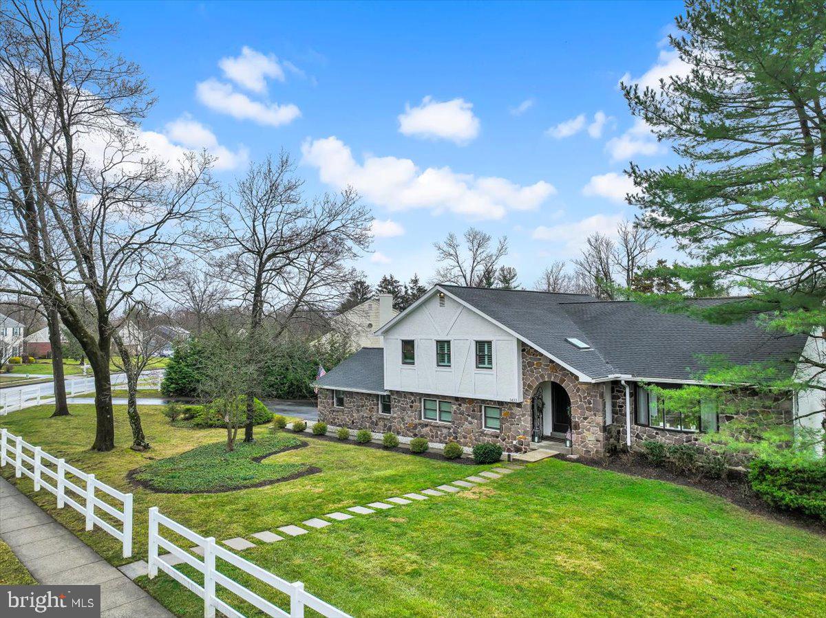 1433 Southwind Way Dresher, PA 19025 - Photo 30 of 37 a view of a house with a big yard and large trees