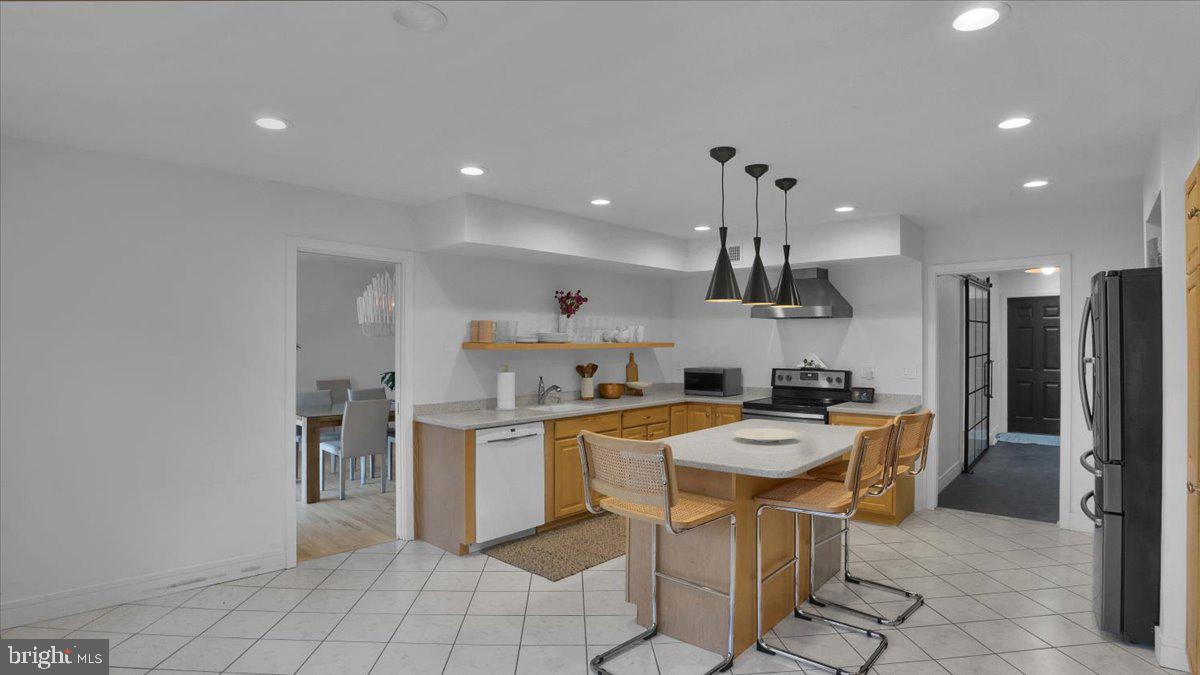 1433 Southwind Way Dresher, PA 19025 - Photo 7 of 37 a kitchen with a sink a counter top space appliances and cabinets