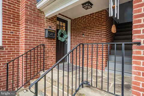 a view of kitchen with cabinets and wooden floor