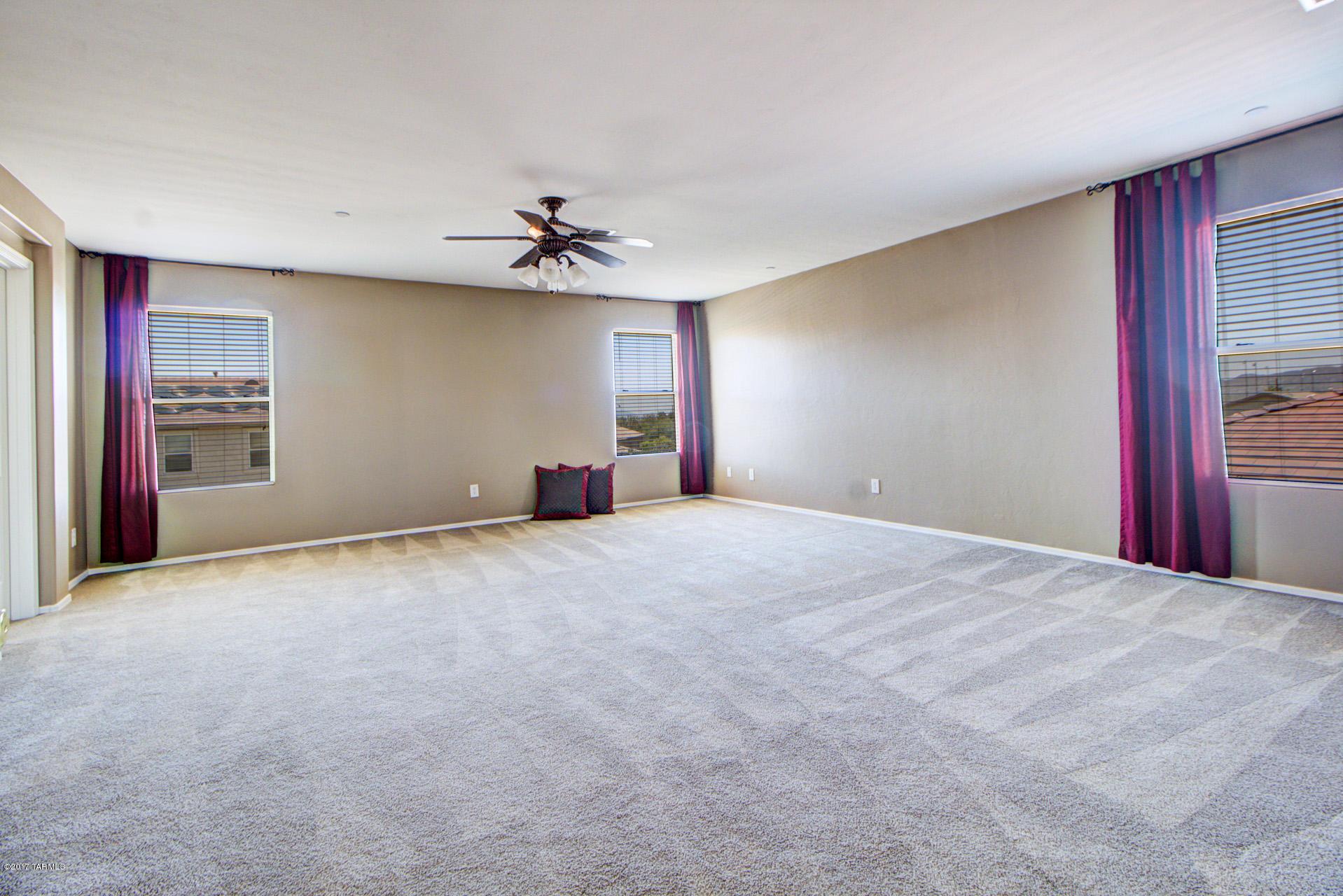 3588 East Mecate Road Tucson, AZ 85739 - Photo 23 of 36 a view of empty room with ceiling fan