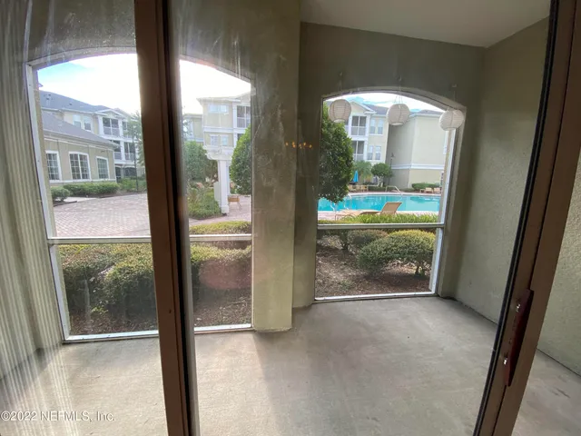 a view of a glass door and porch