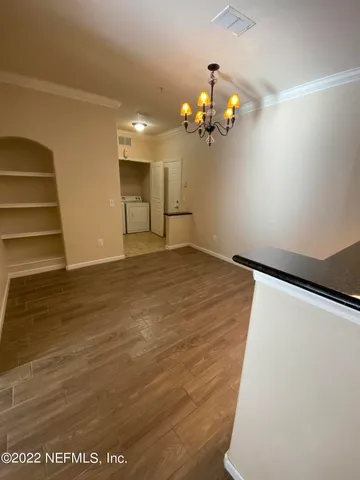 a view of a livingroom with wooden floor