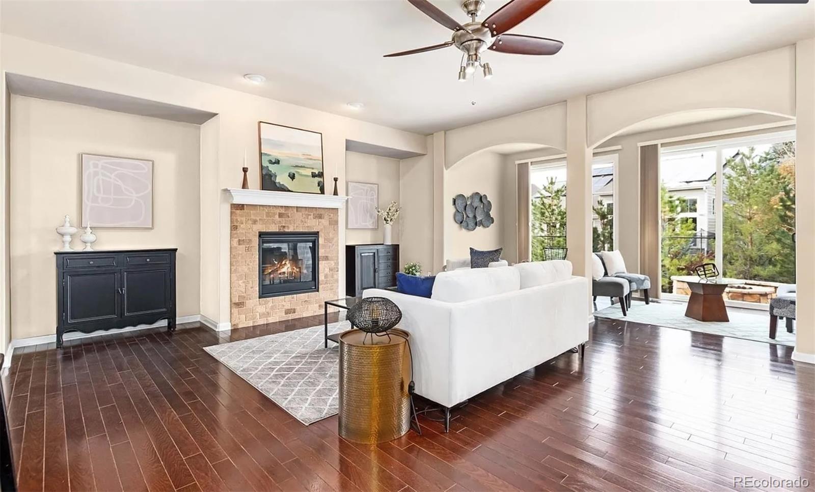 27235 East Lakeview Place Aurora, CO 80016 - Photo 6 of 22 a living room with furniture fireplace and flat screen tv