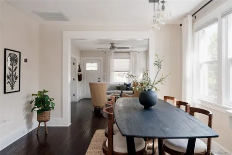 a view of a dining room with furniture window and wooden floor