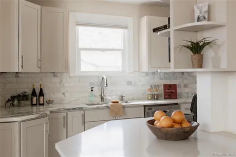 a kitchen with a sink and cabinets