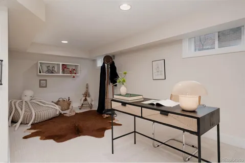 a living room with furniture and a rug