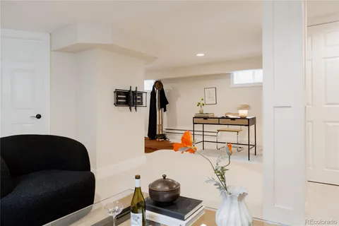 a bedroom with a bed and a lamp on table