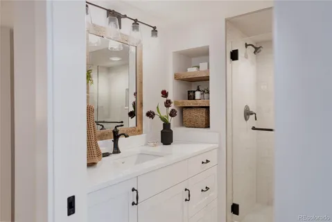 a bathroom with a shower and a sink