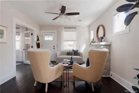 a living room with furniture a window and a dining table