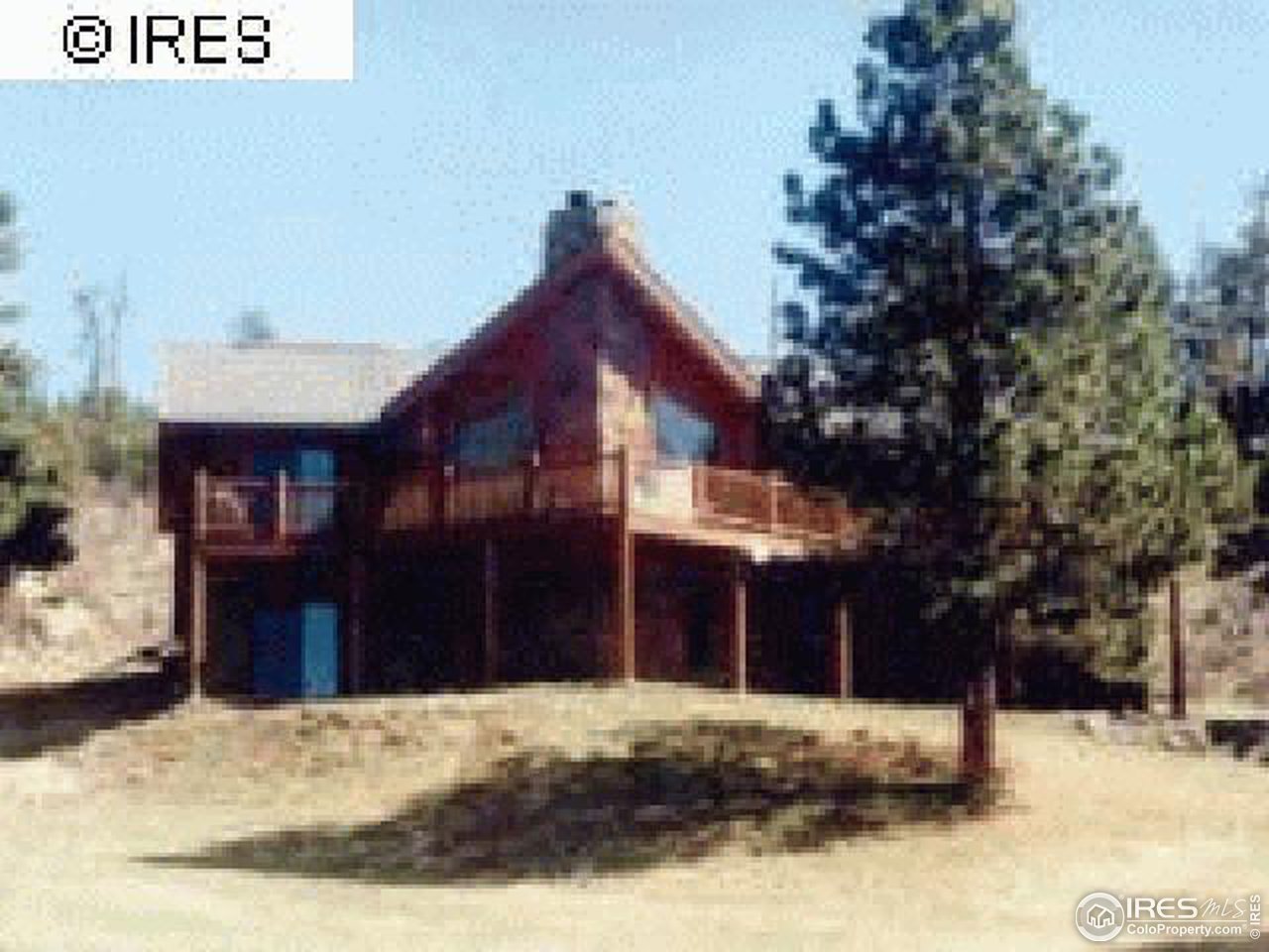 1075 Stove Prairie Road Bellvue, CO 80512 - Photo 1 of 8 a view of a house with a yard covered in snow