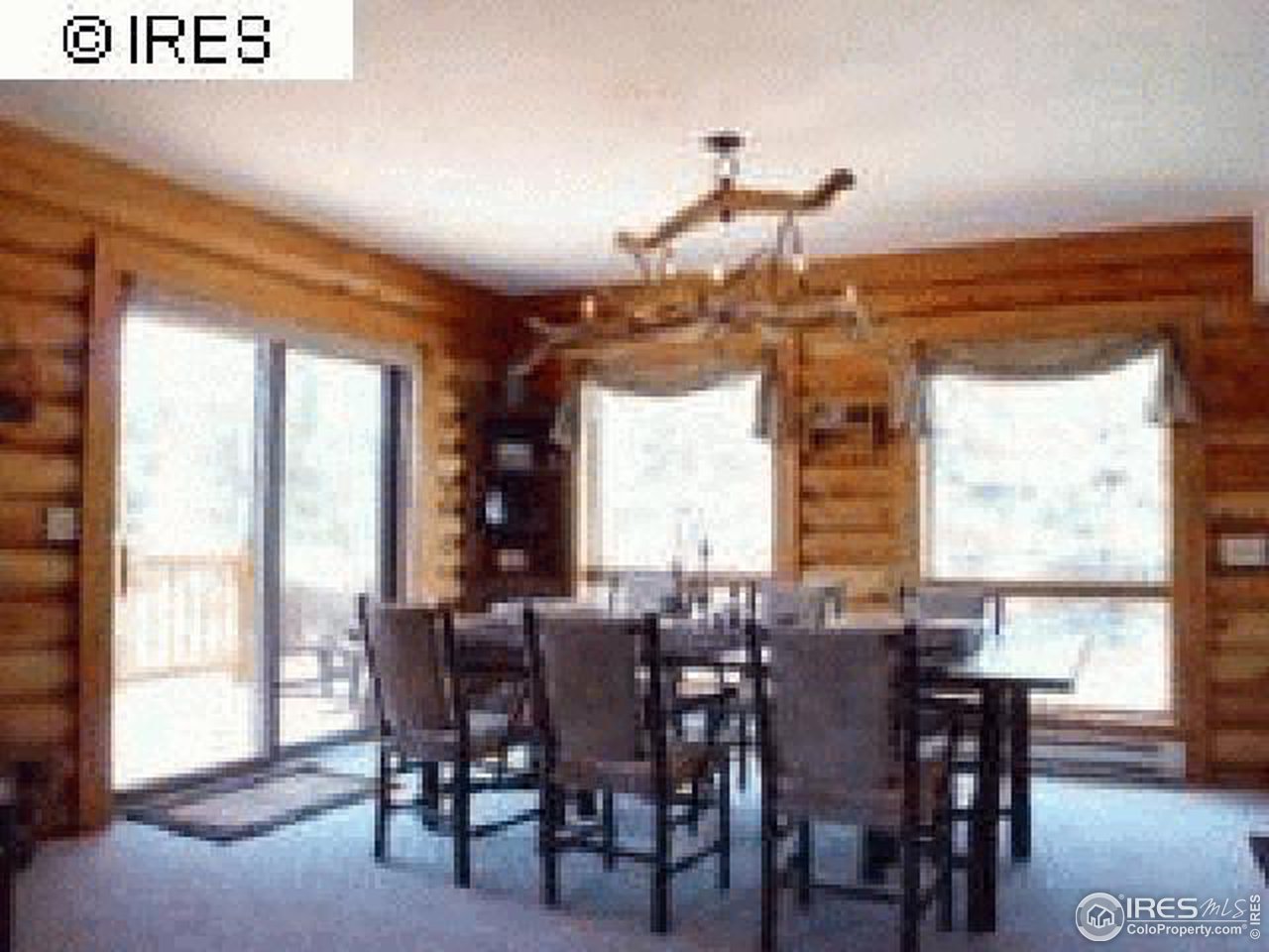 1075 Stove Prairie Road Bellvue, CO 80512 - Photo 7 of 8 a view of a dining room with furniture window and outside view