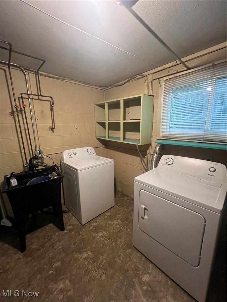 218 Nobottom Road Berea, OH 44017 - Photo 11 of 14 Laundry room with a textured ceiling and washer and dryer