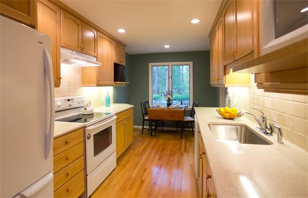 6 Steepletree Lane, Unit 6 Wayland, MA 01778 - Photo 11 of 16 a kitchen with a sink a counter top space stainless steel appliances and a window