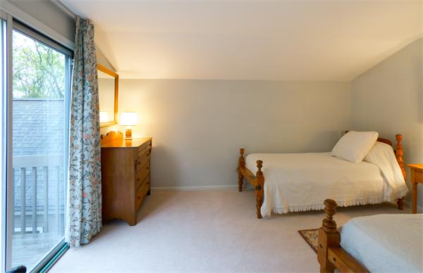 6 Steepletree Lane, Unit 6 Wayland, MA 01778 - Photo 13 of 16 a bedroom with a bed and a window