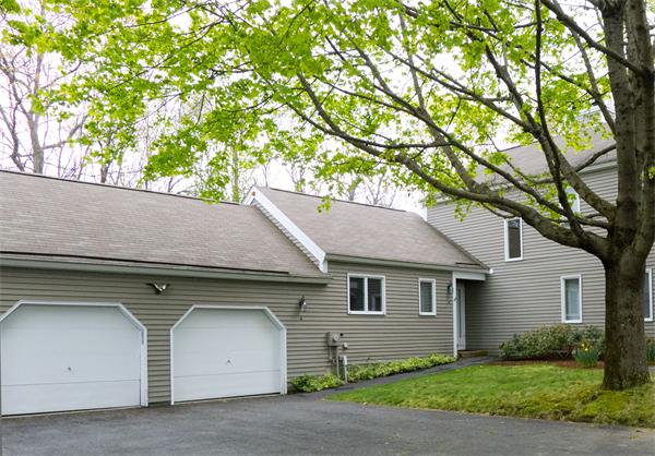 6 Steepletree Lane, Unit 6 Wayland, MA 01778 - Photo 16 of 16 a house with trees in the background