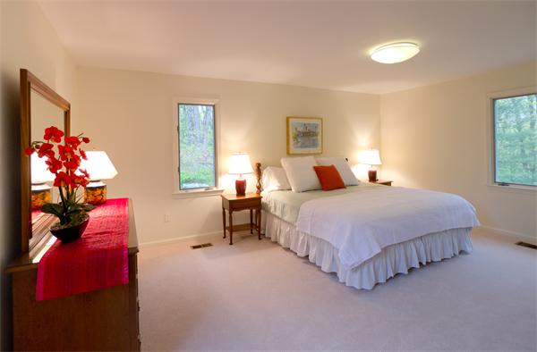 6 Steepletree Lane, Unit 6 Wayland, MA 01778 - Photo 2 of 16 a bedroom with a bed and a window