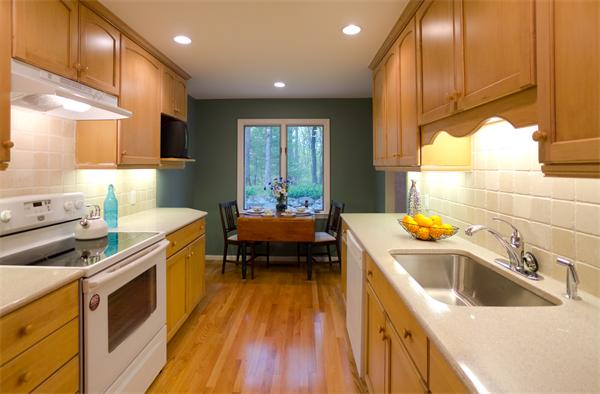 6 Steepletree Lane, Unit 6 Wayland, MA 01778 - Photo 4 of 16 a kitchen with a sink and wooden cabinets