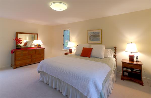6 Steepletree Lane, Unit 6 Wayland, MA 01778 - Photo 6 of 16 a bedroom with bed and window