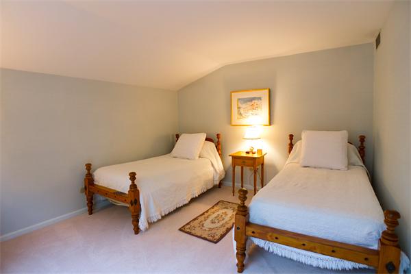 6 Steepletree Lane, Unit 6 Wayland, MA 01778 - Photo 7 of 16 a bedroom with two beds and window