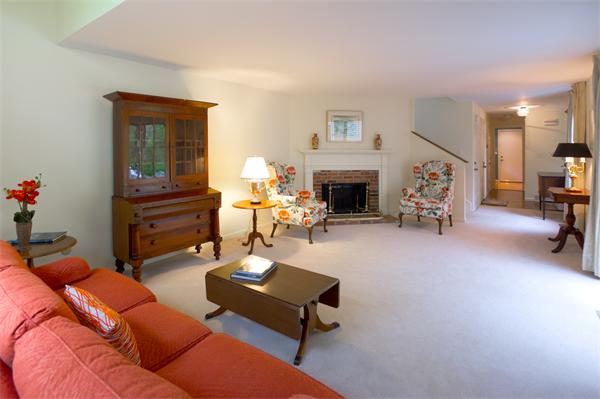 6 Steepletree Lane, Unit 6 Wayland, MA 01778 - Photo 10 of 16 a living room with furniture and a fireplace