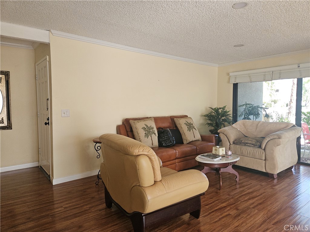 3155 Ramon Road, Unit 601 Palm Springs, CA 92264 - Photo 29 of 35 a living room with furniture and a wooden floor