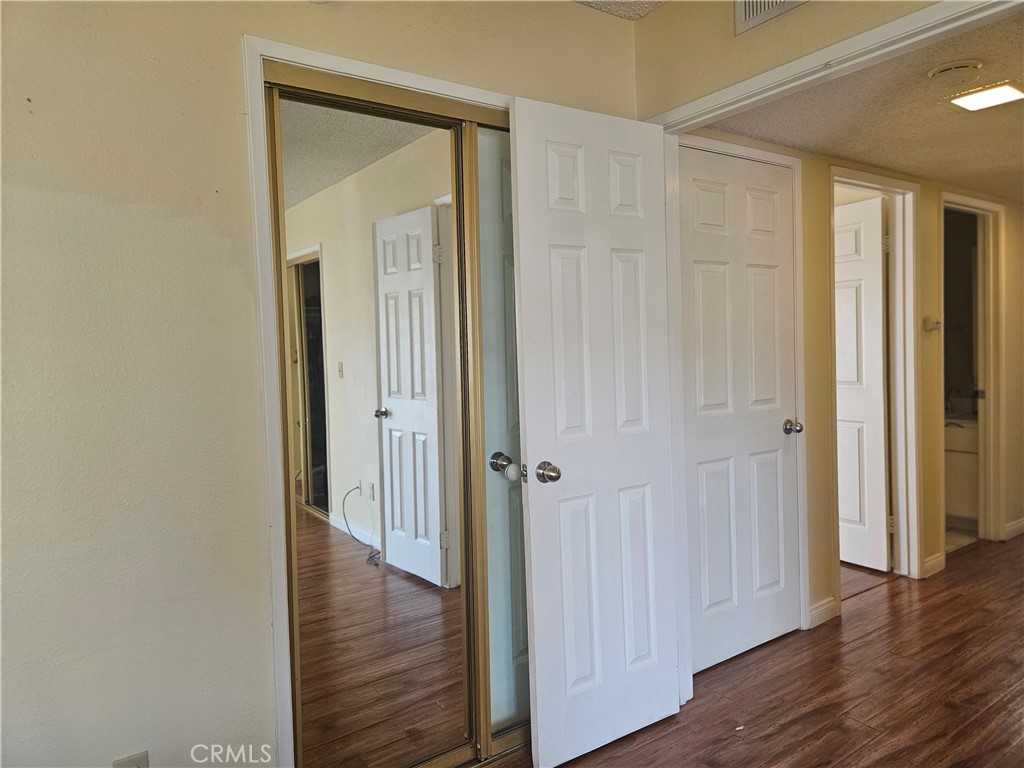 3155 Ramon Road, Unit 601 Palm Springs, CA 92264 - Photo 10 of 35 a view of a hallway with wooden floor