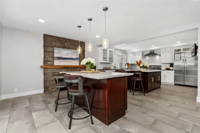 a kitchen with a dining table and chairs