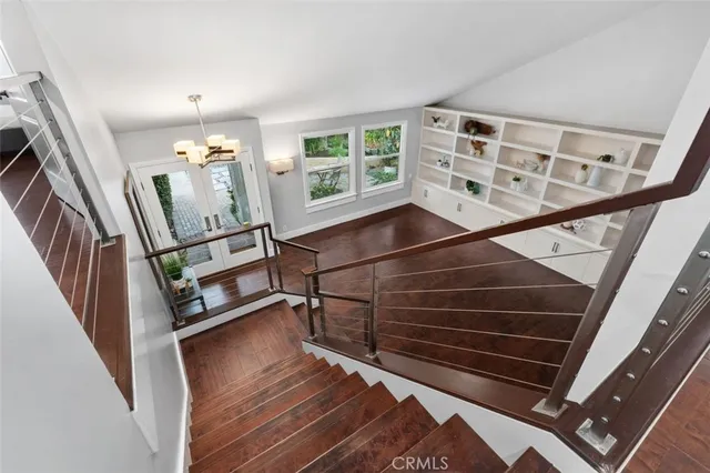 a bathroom with a granite countertop sink a large mirror and a bathtub