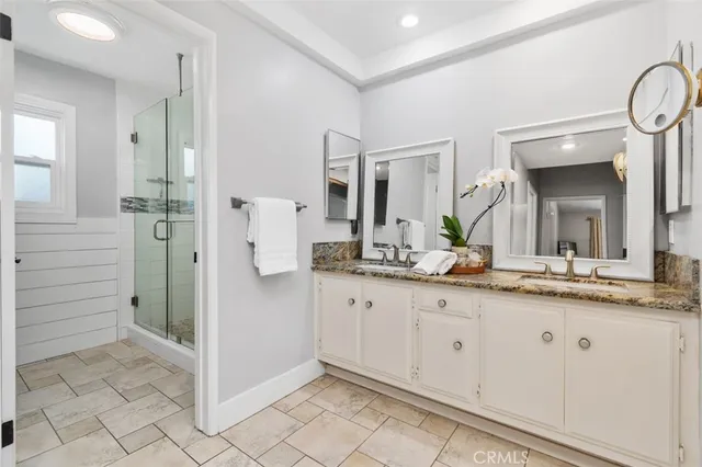a view of a house with swimming pool and sitting area