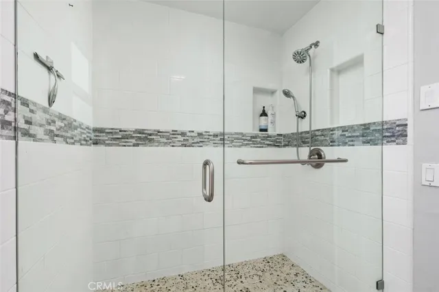 a view of a swimming pool with chairs in patio