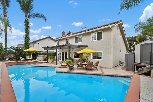 a view of a patio with swimming pool table and chairs