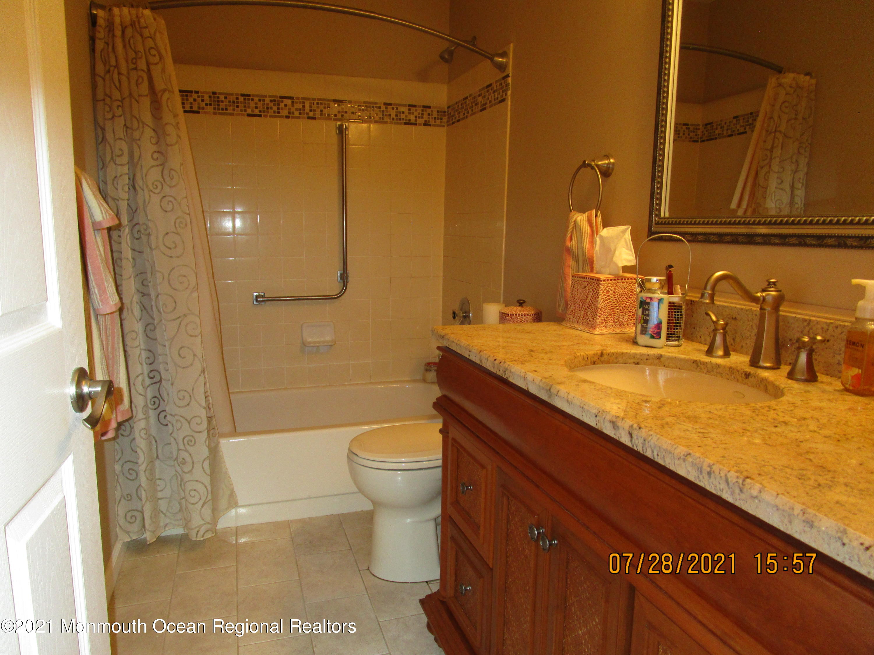 16 D Ashley Road Whiting, NJ 08759 - Photo 10 of 15 a bathroom with a granite countertop sink toilet and shower