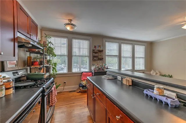 a kitchen with a large window and a sink