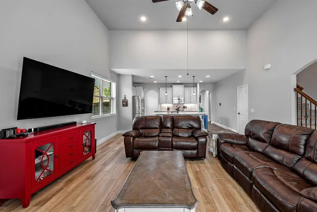 a living room with furniture fireplace and flat screen tv